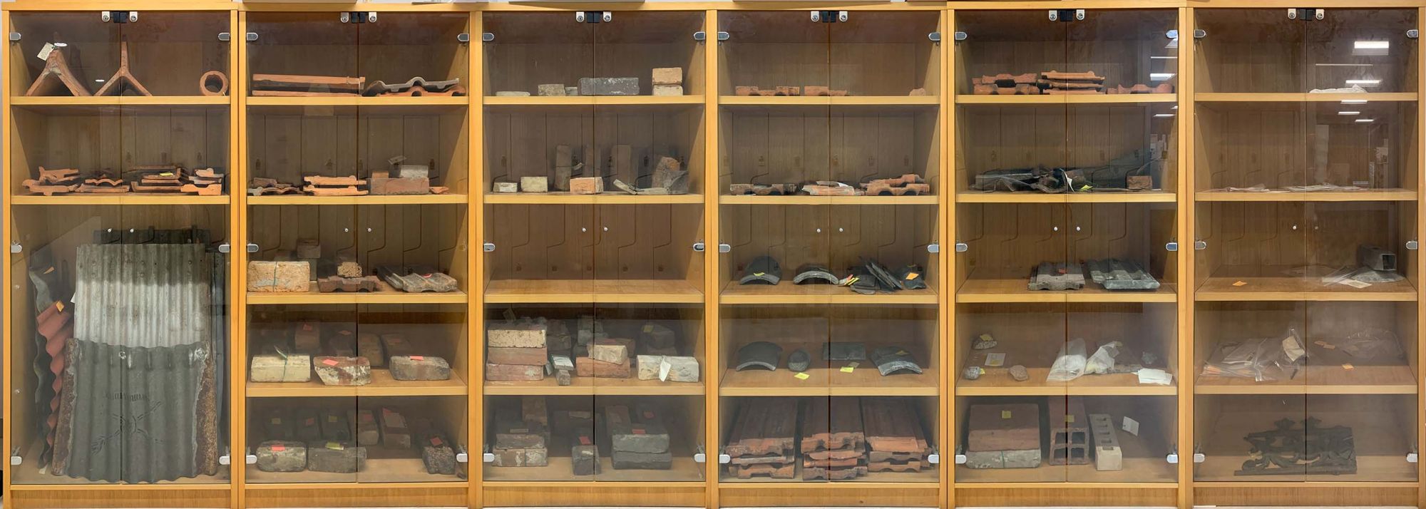 Collection in wooden cabinets at the Melbourne School of Design, Glyn Davis Building.